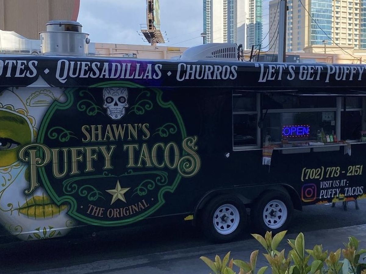 The Shawn's Puffy Tacos truck with its service window open